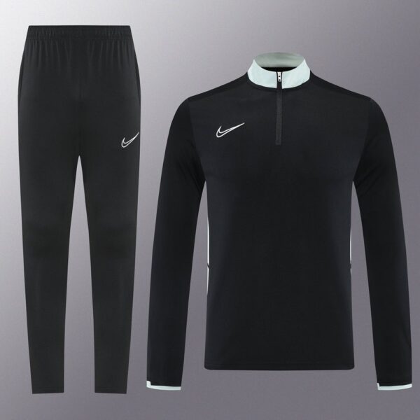 Nike Dri-Fit black tracksuit with white accents, ideal for sports and training.