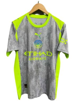 Manchester City third football jersey 2025/26 with neon yellow accents and water droplet design.