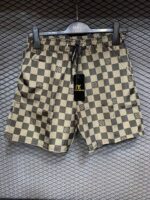 LV Damier Beige checkered swim shorts for men.