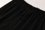 Black Nike Dri-Fit tracksuit waistband with drawstring.