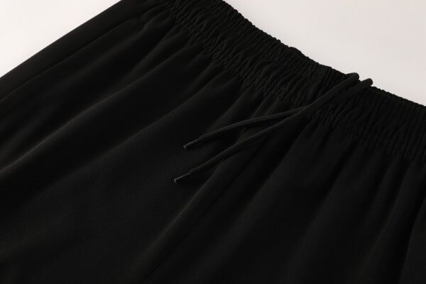 Black Nike Dri-Fit tracksuit waistband with drawstring.