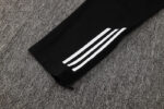 High-quality Adidas white tracksuit with iconic three-stripe design. Perfect for sports and casual w.