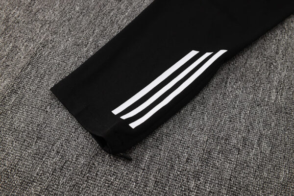 High-quality Adidas white tracksuit with iconic three-stripe design. Perfect for sports and casual w.