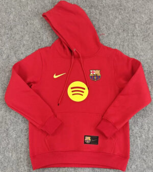 Red FC Barcelona hoodie with team crest, Nike logo, and Spotify badge, perfect for fans.