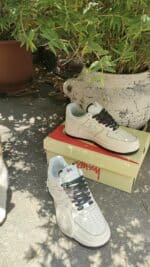 Air Force Low 1 07 sneakers in white and black for men and women.