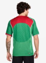 Nike Total 90 men's soccer jersey in vibrant green and red, perfect for football fans and players.