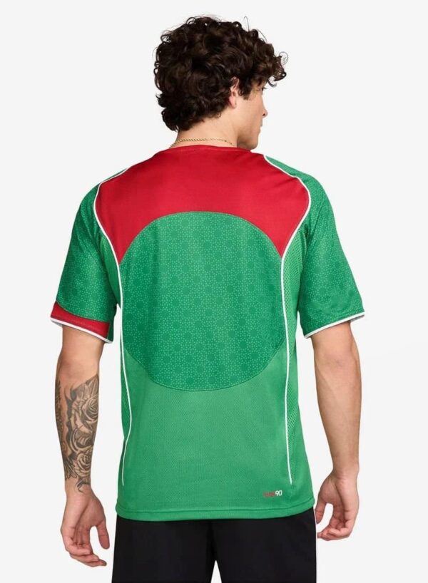 Nike Total 90 men's soccer jersey in vibrant green and red, perfect for football fans and players.