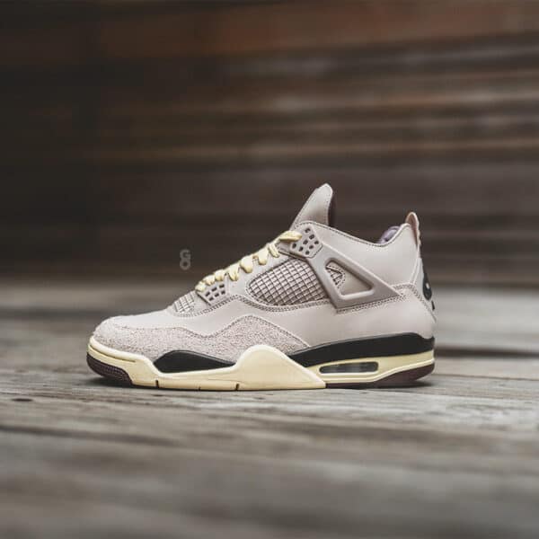 Authentic Air Jordan 4 Fossil Stone sneakers with beige and black accents.