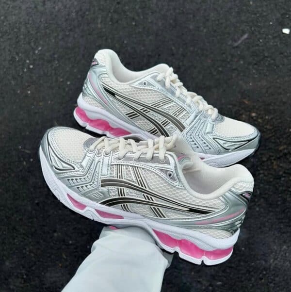 ASICS GEL-Kayano 14 running shoes in cream and pink with metallic accents.