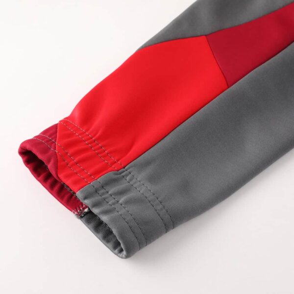 High-quality AC Milan pre-match jacket for 2024/25 season, featuring team colors and logo.