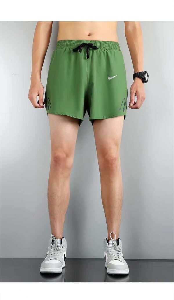 Nike Pro Dri-FIT athletic shorts in green and black.