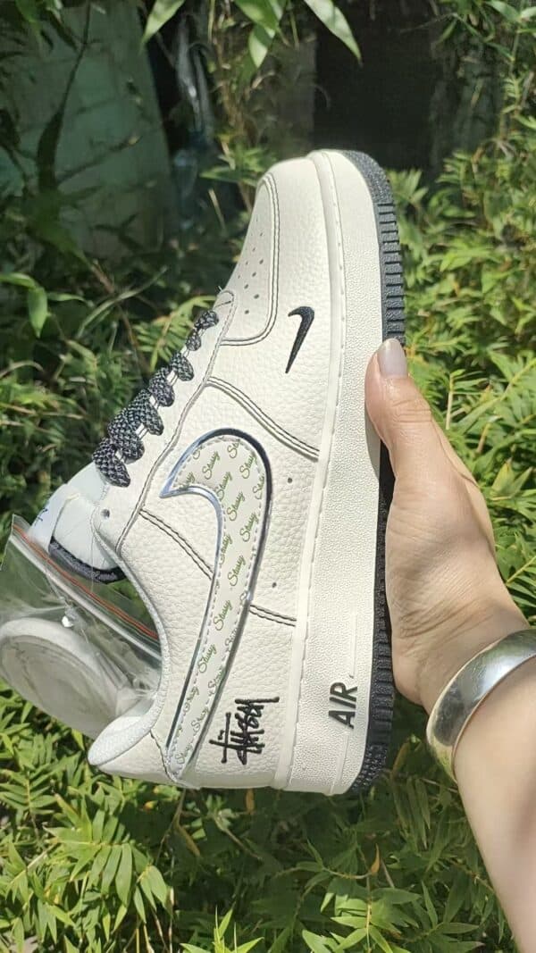 Air Force Low 1 07 white and black sneaker with unique design details.