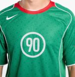Men's Nike Total 90 green soccer jersey with number 90, lightweight and breathable sportswear.