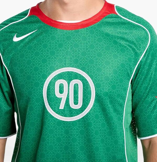 Men's Nike Total 90 green soccer jersey with number 90, lightweight and breathable sportswear.
