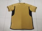 Gold and black football jersey for sports fans and athletes.