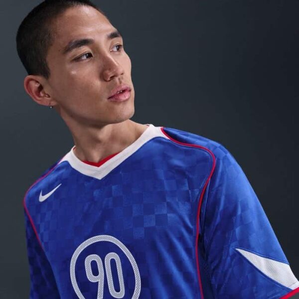 Men's Nike Total 90 soccer jersey in blue with white and red accents.