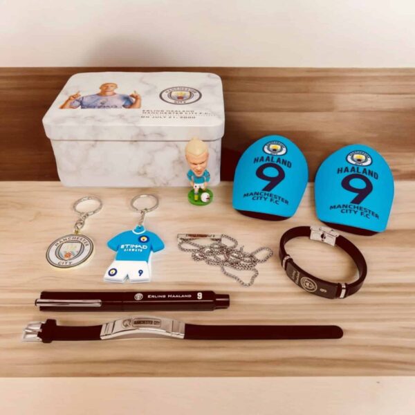 Erling Haaland Manchester City fan merchandise set with keychains, wristbands, and accessories.