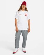 Poland World Cup 2022/23 home football jersey with national emblem and Nike logo.