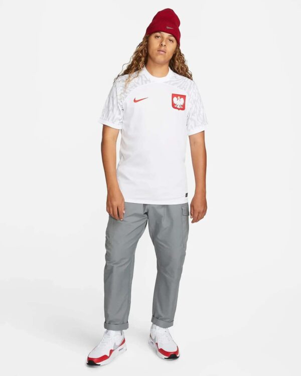 Poland World Cup 2022/23 home football jersey with national emblem and Nike logo.