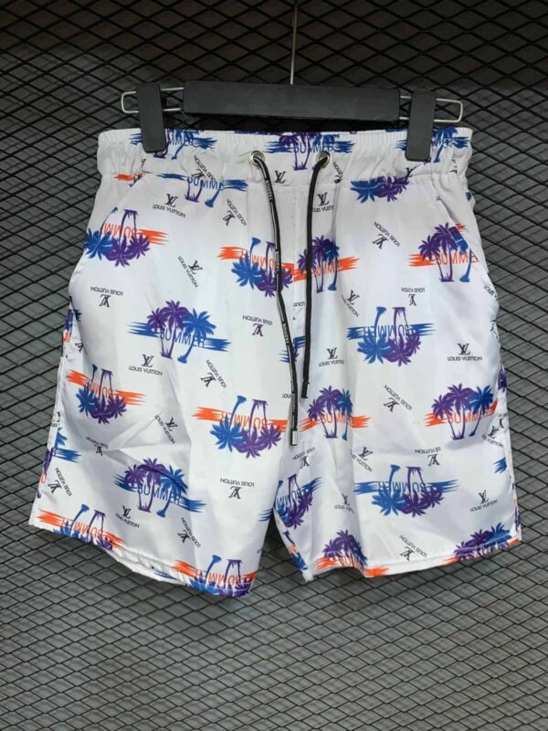 Bright white swim shorts with colorful palm tree and sunset print, perfect for summer beach days.