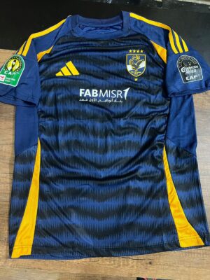 Al Ahly SC navy training jersey for 2024-2025 season with team logo and sponsor.
