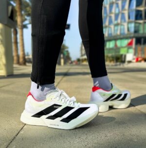 Adidas Adizero Adios Pro 4 white black red running shoes for athletes. Lightweight, high-performance.