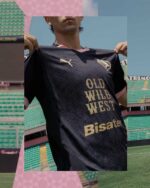 Palermo F.C. away football jersey 2024/25, black with gold accents, official team merchandise.