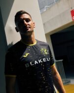 Norwich City away football jersey 2024/25 with team logo and modern design.