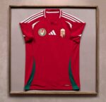 High-quality Hungary 2024 home football jersey with official team logos and vibrant red color.