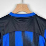 Official Inter Milan kids 2023/24 home football jersey with blue and black design.