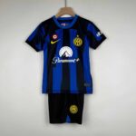 Official Inter Milan kids home football kit for 2023/24 season, featuring blue and black stripes, cl.