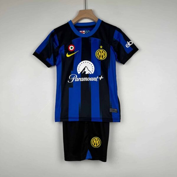 Official Inter Milan kids home football kit for 2023/24 season, featuring blue and black stripes, cl.