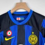 Kids' Inter Milan 2023/24 home football jersey with team logo and Nike branding.
