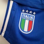 Italy national football team kids home kit 2023/24 with emblem and stars.