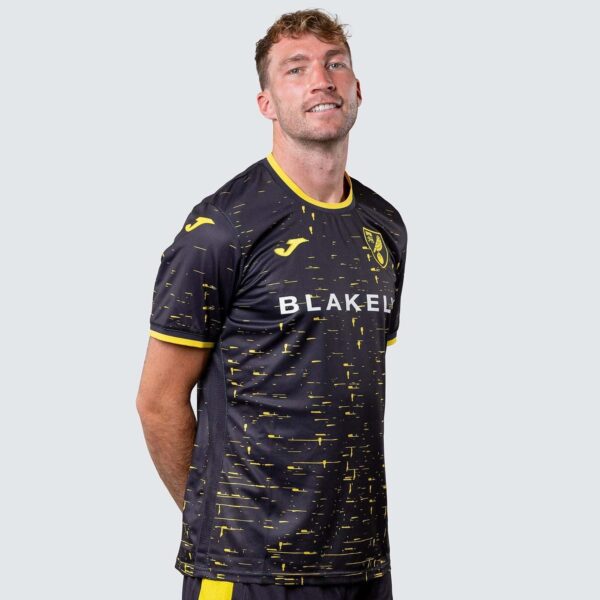 Norwich City away football jersey 2024/25 with black and yellow design.