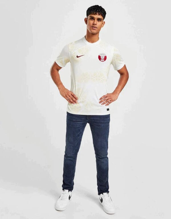 Qatar away football jersey 2024 with team crest and Nike logo, perfect for fans and players.
