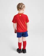 Kids Spain 2024 home football kit with red jersey, blue shorts, and red socks.