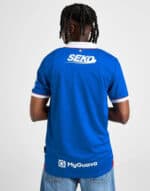 Rangers FC home football jersey 2025/26, blue with white and red accents, official sportswear.