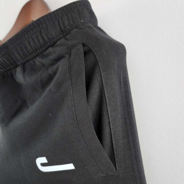 Black Jordan cotton shorts with side pocket, athletic fit, perfect for sports and casual wear.