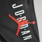 Black Jordan cotton shorts with Jumpman logo and bold text design.