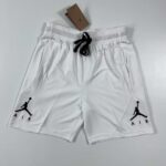 Basketball shorts with Jordan logo, white with black accents, lightweight and breathable.