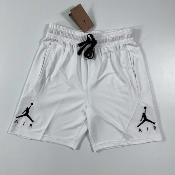 Basketball shorts with Jordan logo, white with black accents, lightweight and breathable.