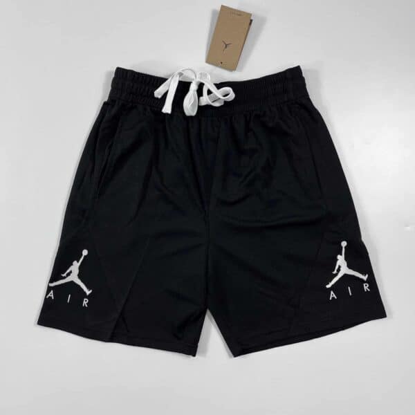 Black Jordan basketball shorts with white Jumpman logo, adjustable drawstring waist, breathable fabr.