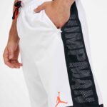 Close-up of Jordan Jumpman basketball shorts with black mesh side panel and logo.