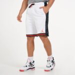 White Jordan basketball shorts with black and red accents, stylish sportswear for men.
