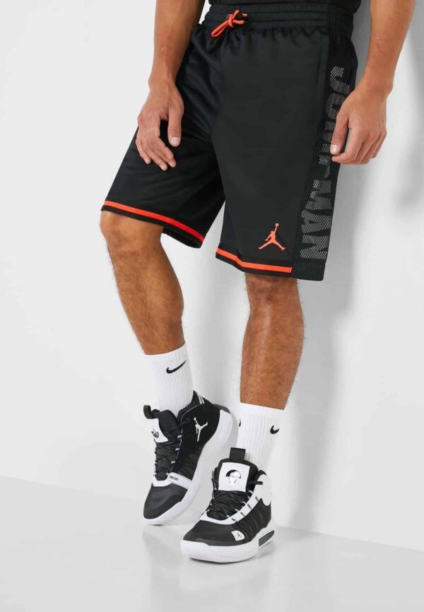Black Jordan basketball shorts with red accents and Jumpman logo.