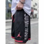 High-quality Jordan Jumpman basketball shorts in black with red accents, featuring breathable fabric.