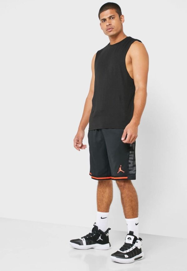 Athletic Jordan basketball shorts featuring Jumpman logo, black with red accents, perfect for sports.