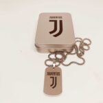 Juventus logo necklace with dog tag pendant, stylish sports jewelry for football fans.