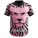 Pink and black Leones Negros football jersey with lion face design.